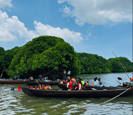 Guests kayaking through mangrove canals at MangroveSpot, Nedungolam, Kollam